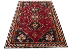 Surface texture of 2000s Shiraz rug with natural Wool and intricate pattern