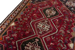 Backside of handmade 2000s Shiraz rug showing knot structure and weave density