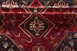 Full view of 2000s Shiraz rug from Iran / Persia, 260 × 170 cm in Red tones