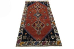 Surface texture of 2000s Shiraz rug with natural Wool and intricate pattern