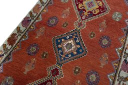 Backside of handmade 2000s Shiraz rug showing knot structure and weave density