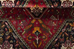 Corner detail of 2000s Shiraz rug showing border pattern and Wool pile