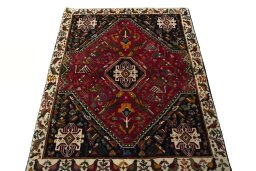 Surface texture of 2000s Shiraz rug with natural Wool and intricate pattern