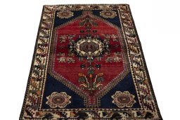 Surface texture of 2000s Shiraz rug with natural Wool and intricate pattern