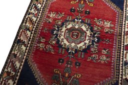 Backside of handmade 2000s Shiraz rug showing knot structure and weave density