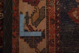 Surface texture of 2000s Shiraz rug with natural Wool and intricate pattern