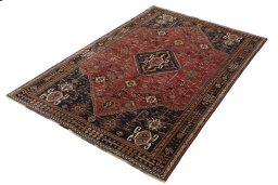Corner detail of 2000s Shiraz rug showing border pattern and Wool pile