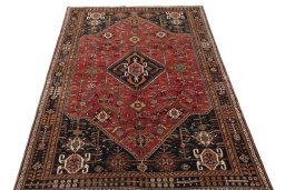 Surface texture of 2000s Shiraz rug with natural Wool and intricate pattern