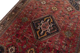 Backside of handmade 2000s Shiraz rug showing knot structure and weave density