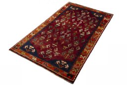 Corner detail of 2000s Shiraz rug showing border pattern and Wool pile