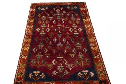 Surface texture of 2000s Shiraz rug with natural Wool and intricate pattern