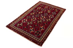 Corner detail of 2000s Shiraz rug showing border pattern and Wool pile
