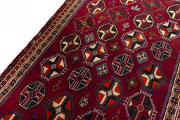 Backside of handmade 2000s Shiraz rug showing knot structure and weave density