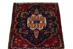 Surface texture of 2000s Shiraz rug with natural Wool and intricate pattern