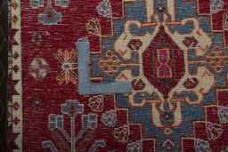 Backside of handmade 2000s Shiraz rug showing knot structure and weave density