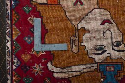 Backside of handmade 2000s Shiraz rug showing knot structure and weave density