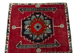 Surface texture of 2000s Shiraz rug with natural Wool and intricate pattern
