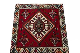 Surface texture of 2000s Shiraz rug with natural Wool and intricate pattern