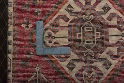 Backside of handmade 2000s Shiraz rug showing knot structure and weave density