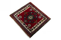 Corner detail of 2000s Shiraz rug showing border pattern and Wool pile