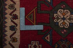 Backside of handmade 2000s Shiraz rug showing knot structure and weave density