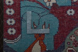 Backside of handmade 2000s Shiraz rug showing knot structure and weave density