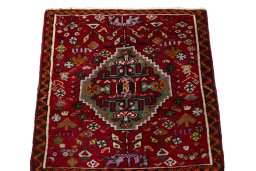 Surface texture of 2000s Shiraz rug with natural Wool and intricate pattern