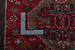 Backside of handmade 2000s Shiraz rug showing knot structure and weave density