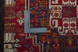 Backside of handmade 2000s Shiraz rug showing knot structure and weave density
