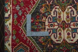 Backside of handmade 2000s Shiraz rug showing knot structure and weave density