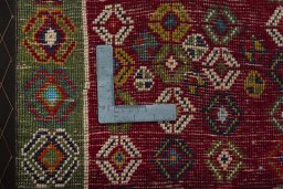 Backside of handmade 2000s Shiraz rug showing knot structure and weave density