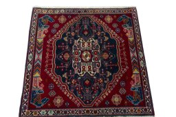 Surface texture of 2000s Shiraz rug with natural Wool and intricate pattern