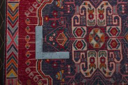 Backside of handmade 2000s Shiraz rug showing knot structure and weave density