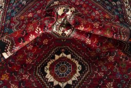 Corner detail of 1970s Shiraz rug showing border pattern and Wool pile