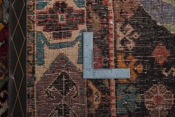 Surface texture of 2000s Shiraz rug with natural Wool and intricate pattern
