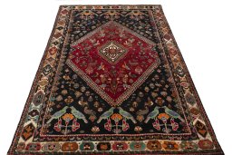 Surface texture of 2000s Shiraz rug with natural Wool and intricate pattern