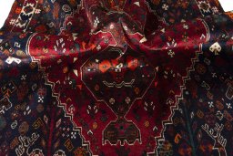 Corner detail of 2000s Shiraz rug showing border pattern and Wool pile