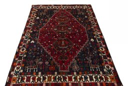 Surface texture of 2000s Shiraz rug with natural Wool and intricate pattern