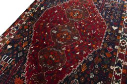 Backside of handmade 2000s Shiraz rug showing knot structure and weave density