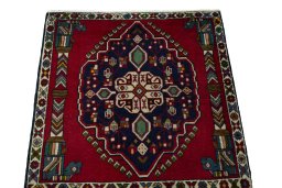 Surface texture of 2000s Shiraz rug with natural Wool and intricate pattern
