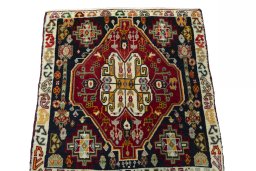 Surface texture of 2000s Shiraz rug with natural Wool and intricate pattern
