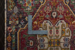 Backside of handmade 2000s Shiraz rug showing knot structure and weave density