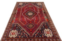 Surface texture of 2000s Shiraz rug with natural Wool and intricate pattern