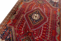 Backside of handmade 2000s Shiraz rug showing knot structure and weave density