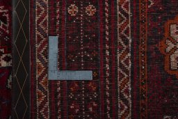 Corner detail of 1970s Shiraz rug showing border pattern and Wool pile