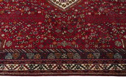 Corner detail of 2000s Shiraz rug showing border pattern and Wool pile