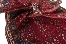 Surface texture of 2000s Shiraz rug with natural Wool and intricate pattern