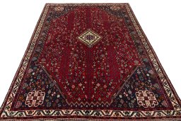 Surface texture of 2000s Shiraz rug with natural Wool and intricate pattern