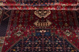 Corner detail of 2000s Shiraz rug showing border pattern and Wool pile
