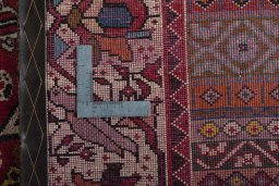 Surface texture of 2000s Shiraz rug with natural Wool and intricate pattern
